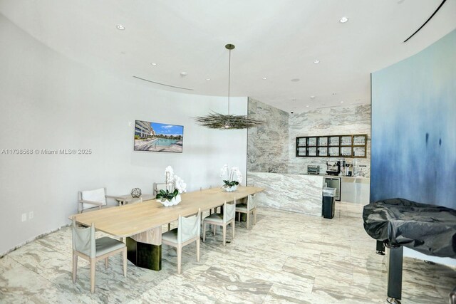 dining space with recessed lighting