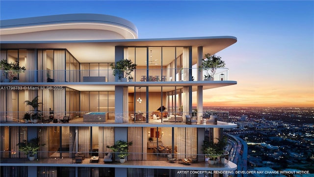 rear view of property with a balcony