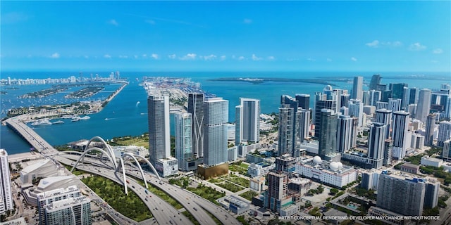 view of urban area featuring a large body of water and a major roadway