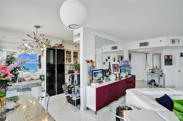 7330 Ocean Ter Unit 8-C, Miami Beach, FL 33141 - miscellaneous room featuring light tile patterned flooring and a chandelier