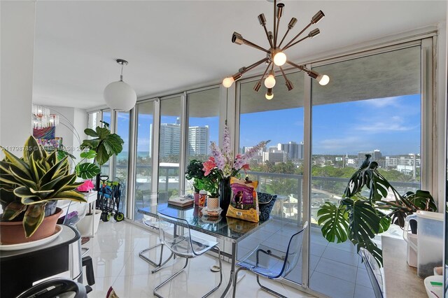 7330 Ocean Ter Unit 8-C, Miami Beach, FL 33141 - sunroom / solarium with a chandelier, a view of skyline, and plenty of natural light