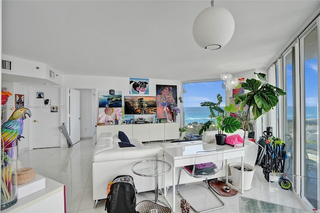 7330 Ocean Ter Unit 8-C, Miami Beach, FL 33141 - living area featuring light tile patterned floors and floor to ceiling windows