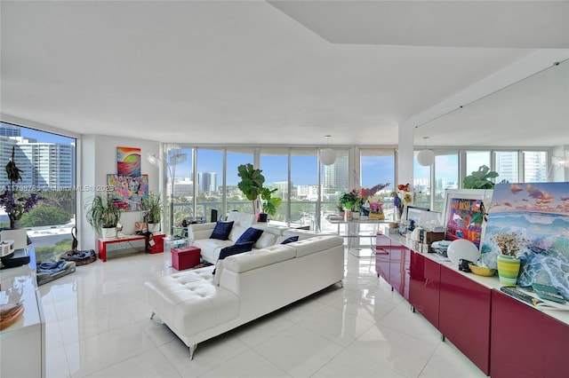 7330 Ocean Ter Unit 8-C, Miami Beach, FL 33141 - living room featuring floor to ceiling windows, plenty of natural light, light tile patterned flooring, and a city view