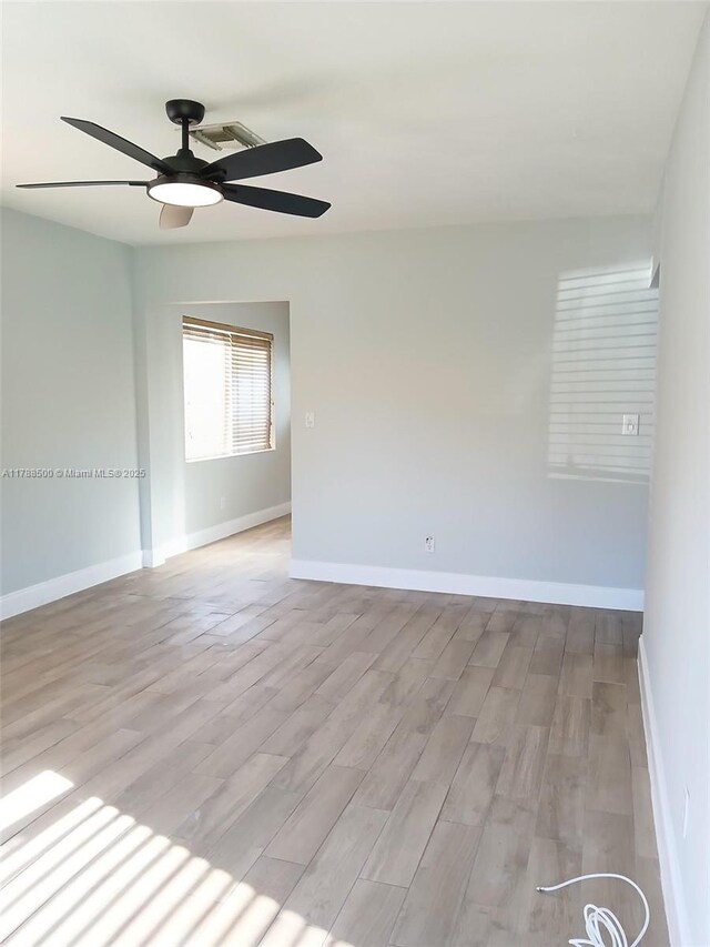 2641 SW 13th Ave, Fort Lauderdale, FL 33315 - unfurnished room featuring light wood finished floors, a ceiling fan, and baseboards