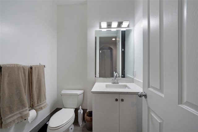 half bath with vanity and toilet