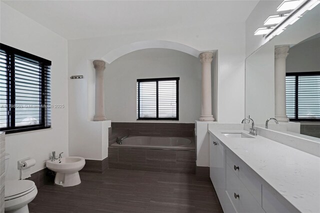 7567 SW 189th St, Cutler Bay, FL 33157 - bathroom with decorative columns, a garden tub, a bidet, toilet, and vanity