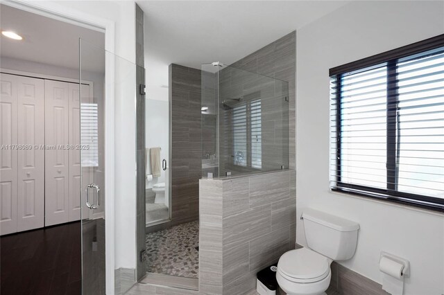 7567 SW 189th St, Cutler Bay, FL 33157 - bathroom with toilet, a stall shower, healthy amount of natural light, and recessed lighting