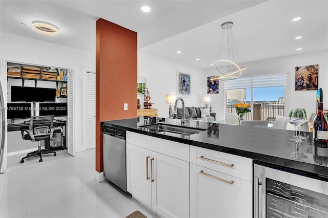 2650 SW 37th Ave Unit 906, Miami, FL 33133 - kitchen featuring wine cooler, dishwasher, a sink, dark countertops, and white cabinetry