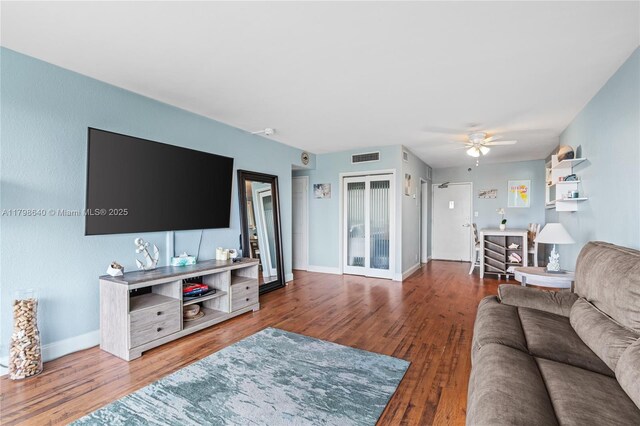 1000 W Ave Unit 308, Miami Beach, FL 33139 - living area with wood finished floors, a ceiling fan, and baseboards