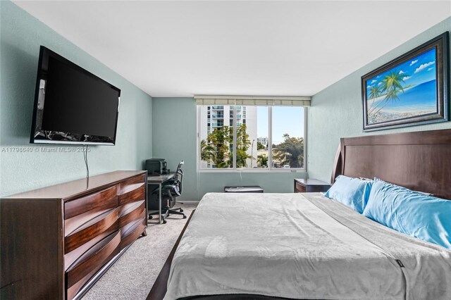 1000 W Ave Unit 308, Miami Beach, FL 33139 - bedroom featuring carpet flooring and a desk