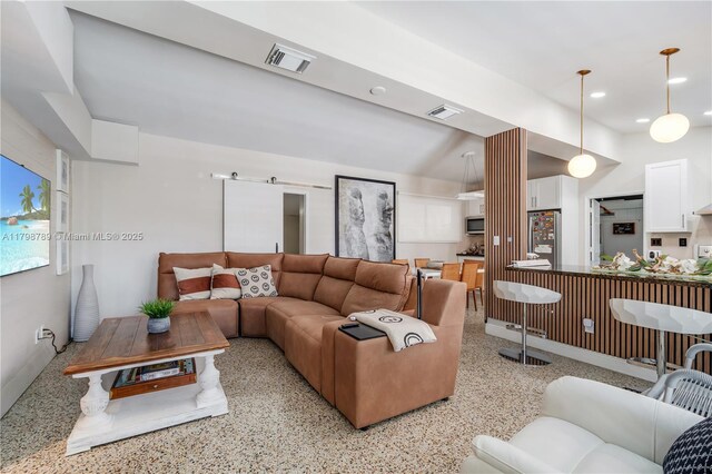 1245 NE 154th St, North Miami Beach, FL 33162 - living room featuring dark aggregate flooring, recessed lighting, and decorative columns