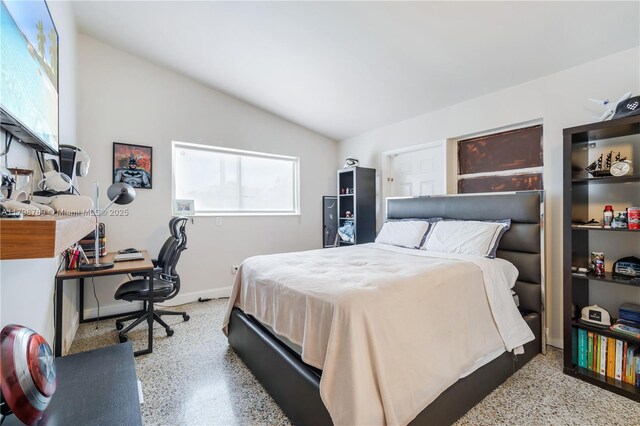 1245 NE 154th St, North Miami Beach, FL 33162 - bedroom featuring speckle patterned floor, lofted ceiling, an office area, and baseboards