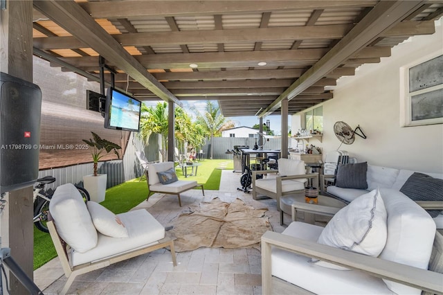 view of patio / terrace with outdoor lounge area and fence