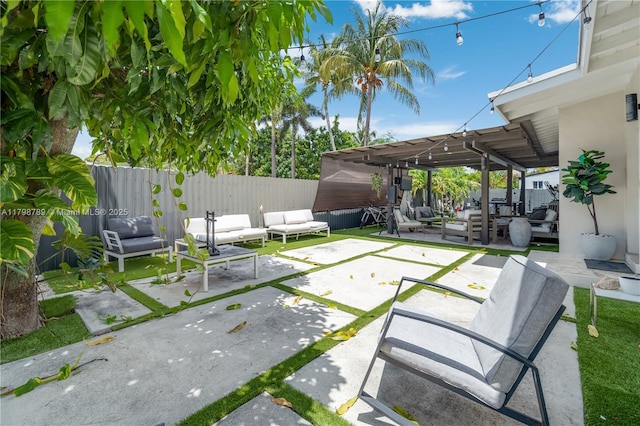 view of patio / terrace with an outdoor living space and a fenced backyard