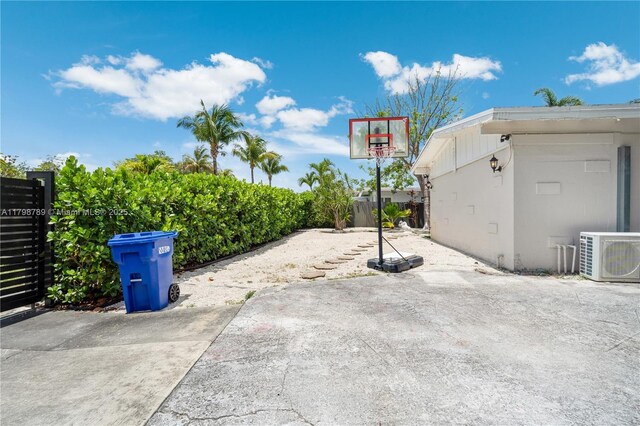 1245 NE 154th St, North Miami Beach, FL 33162 - rear view of property featuring a patio area, fence, and stucco siding
