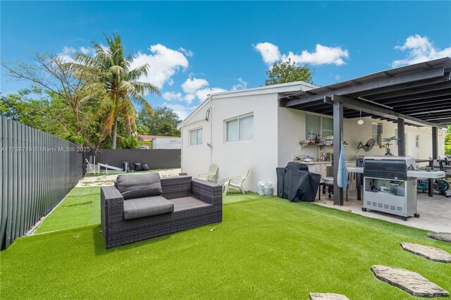 1245 NE 154th St, North Miami Beach, FL 33162 - back of property with a patio, ac unit, and a sunroom