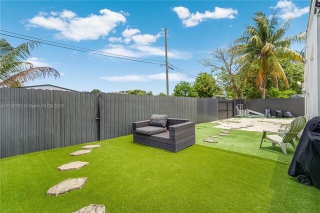 1245 NE 154th St, North Miami Beach, FL 33162 - rear view of property with fence, stucco siding, and central AC