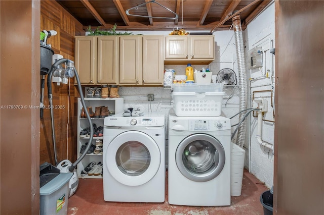 laundry room with cabinet space and separate washer and dryer