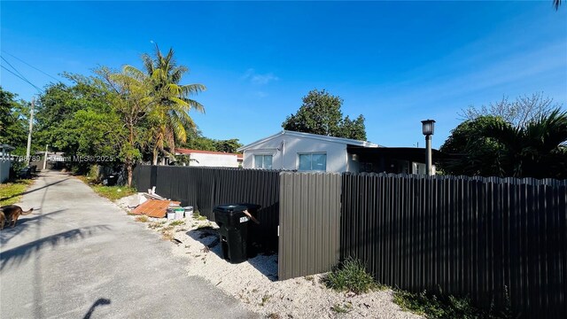 1245 NE 154th St, North Miami Beach, FL 33162 - view of asphalt road featuring street lighting