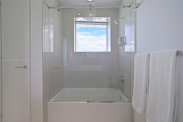 full bath featuring combined bath / shower with glass door