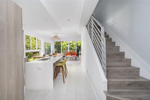2475 NE 135th St, North Miami, FL 33181 - stairs with plenty of natural light and tile patterned flooring