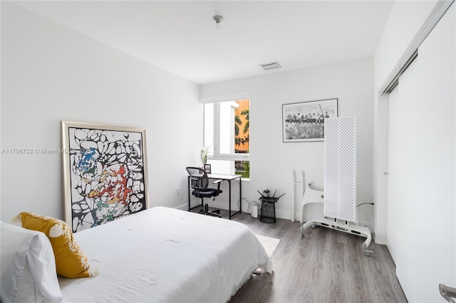 2475 NE 135th St, North Miami, FL 33181 - bedroom with wood finished floors