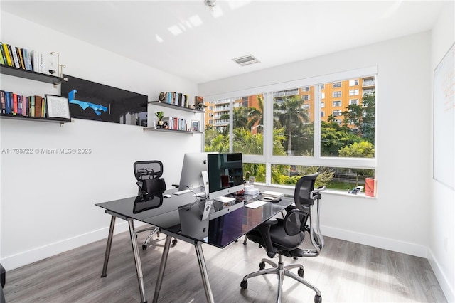 2475 NE 135th St, North Miami, FL 33181 - home office with wood finished floors and baseboards