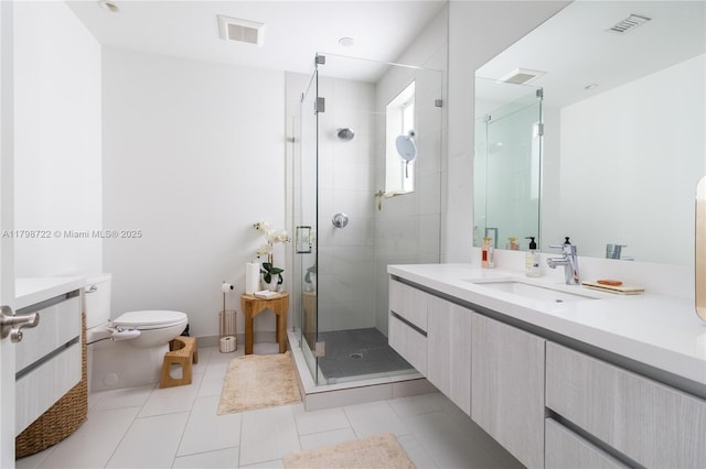 2475 NE 135th St, North Miami, FL 33181 - bathroom featuring a shower stall, vanity, toilet, and tile patterned flooring