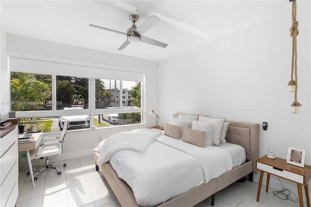 2475 NE 135th St, North Miami, FL 33181 - bedroom featuring a desk, light tile patterned floors, and a ceiling fan