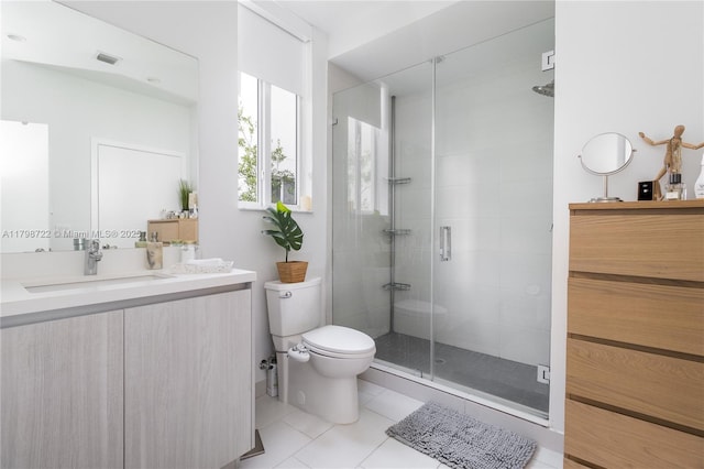 2475 NE 135th St, North Miami, FL 33181 - full bathroom with a stall shower, vanity, toilet, and tile patterned flooring