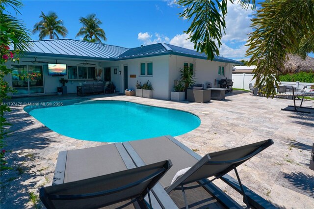 2711 NE 57th Ct, Fort Lauderdale, FL 33308 - swimming pool with outdoor lounge area, a ceiling fan, and a patio area