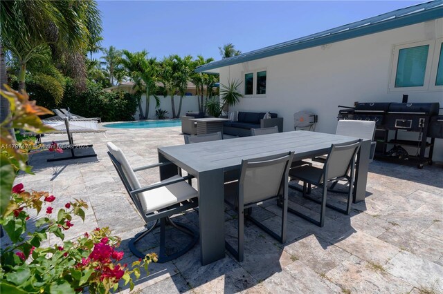 2711 NE 57th Ct, Fort Lauderdale, FL 33308 - view of patio featuring outdoor dining area and fence