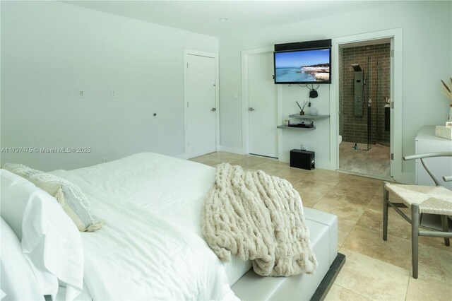 2711 NE 57th Ct, Fort Lauderdale, FL 33308 - bedroom featuring electric panel, connected bathroom, and tile patterned floors