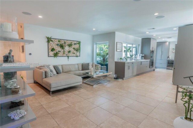 2711 NE 57th Ct, Fort Lauderdale, FL 33308 - living area with recessed lighting and light tile patterned floors