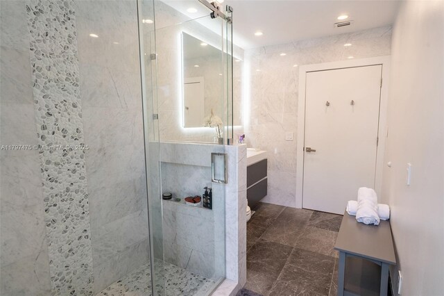 2711 NE 57th Ct, Fort Lauderdale, FL 33308 - full bath with tile walls, a shower stall, vanity, recessed lighting, and toilet