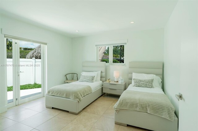 2711 NE 57th Ct, Fort Lauderdale, FL 33308 - bedroom featuring access to exterior, multiple windows, light tile patterned flooring, and recessed lighting