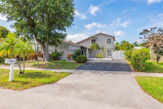 3865 NW 1st Pl, Deerfield Beach, FL 33442 - view of front facade featuring asphalt driveway and stucco siding
