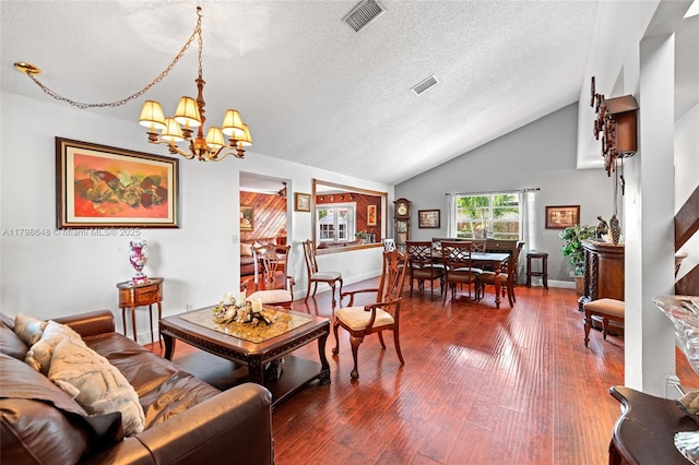 3865 NW 1st Pl, Deerfield Beach, FL 33442 - living area featuring a textured ceiling, a chandelier, vaulted ceiling, wood-type flooring, and baseboards