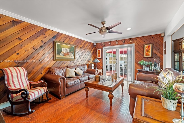 3865 NW 1st Pl, Deerfield Beach, FL 33442 - living area featuring a ceiling fan, ornamental molding, and wood walls