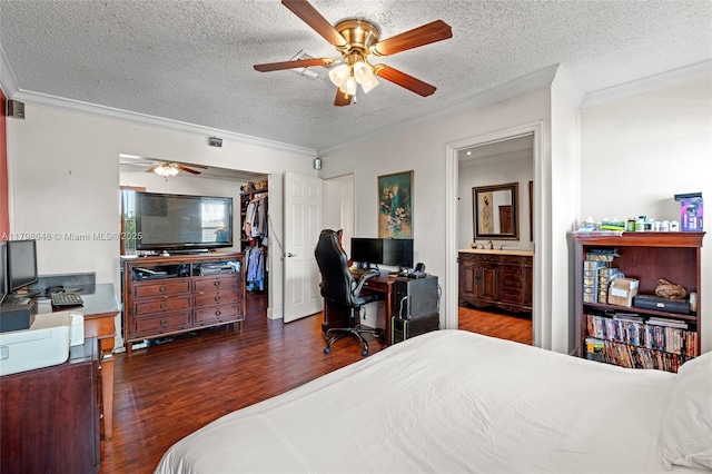 3865 NW 1st Pl, Deerfield Beach, FL 33442 - bedroom featuring crown molding, wood finished floors, an office area, a textured ceiling, and a spacious closet