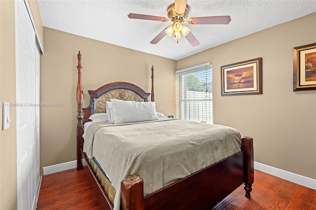 3865 NW 1st Pl, Deerfield Beach, FL 33442 - bedroom with baseboards, dark wood-type flooring, a textured ceiling, and ceiling fan