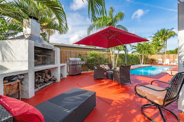 3865 NW 1st Pl, Deerfield Beach, FL 33442 - view of patio / terrace with an outdoor living space with a fireplace, grilling area, and a fenced backyard