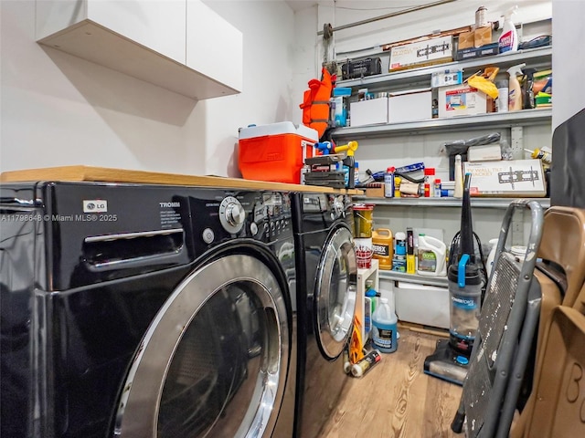 3865 NW 1st Pl, Deerfield Beach, FL 33442 - clothes washing area with washing machine and clothes dryer and wood finished floors