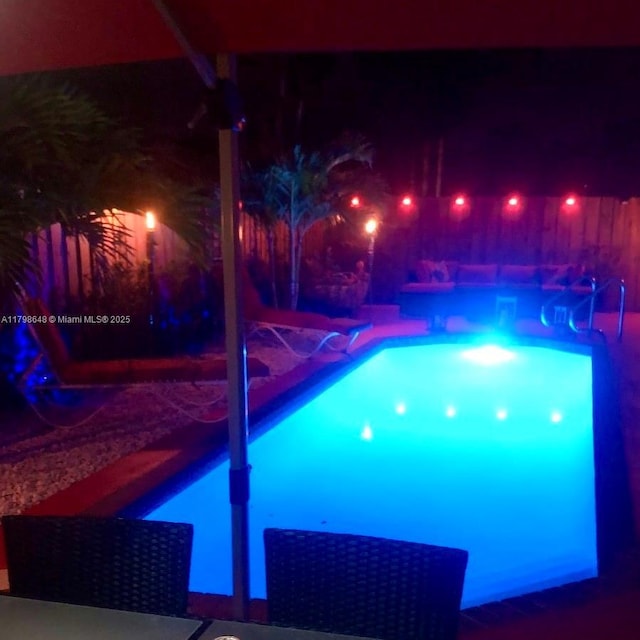 3865 NW 1st Pl, Deerfield Beach, FL 33442 - view of pool at night