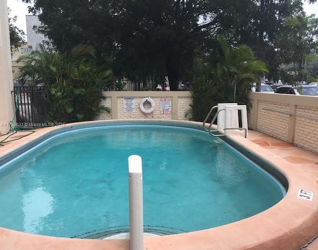 community pool with fence