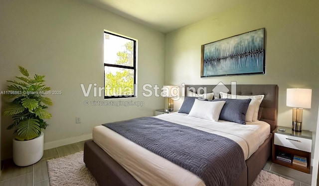 2615 68th St W, Lehigh Acres, FL 33971 - bedroom featuring baseboards and wood finished floors