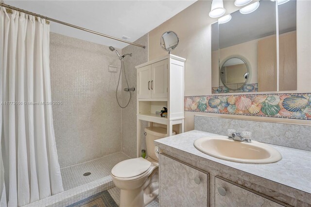 922 NE 199th St Unit 206, Miami, FL 33179 - bathroom with tiled shower, toilet, and vanity