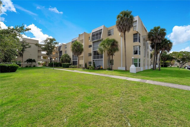 922 NE 199th St Unit 206, Miami, FL 33179 - view of building exterior with a residential view