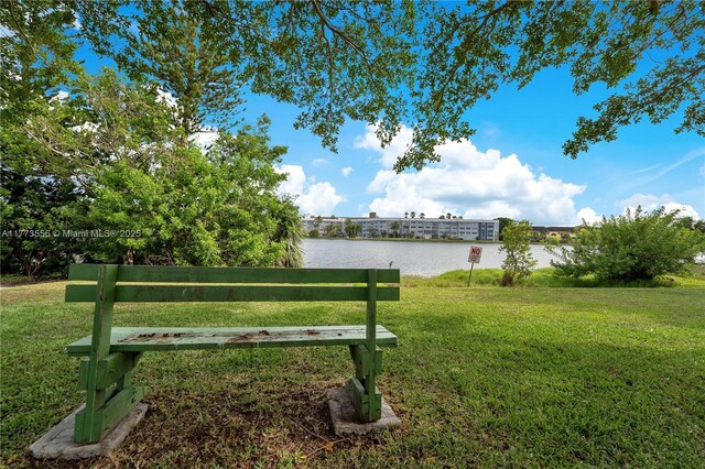922 NE 199th St Unit 206, Miami, FL 33179 - surrounding community featuring a water view and a yard