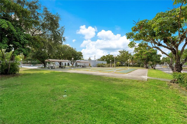 922 NE 199th St Unit 206, Miami, FL 33179 - view of grassy yard with a detached carport